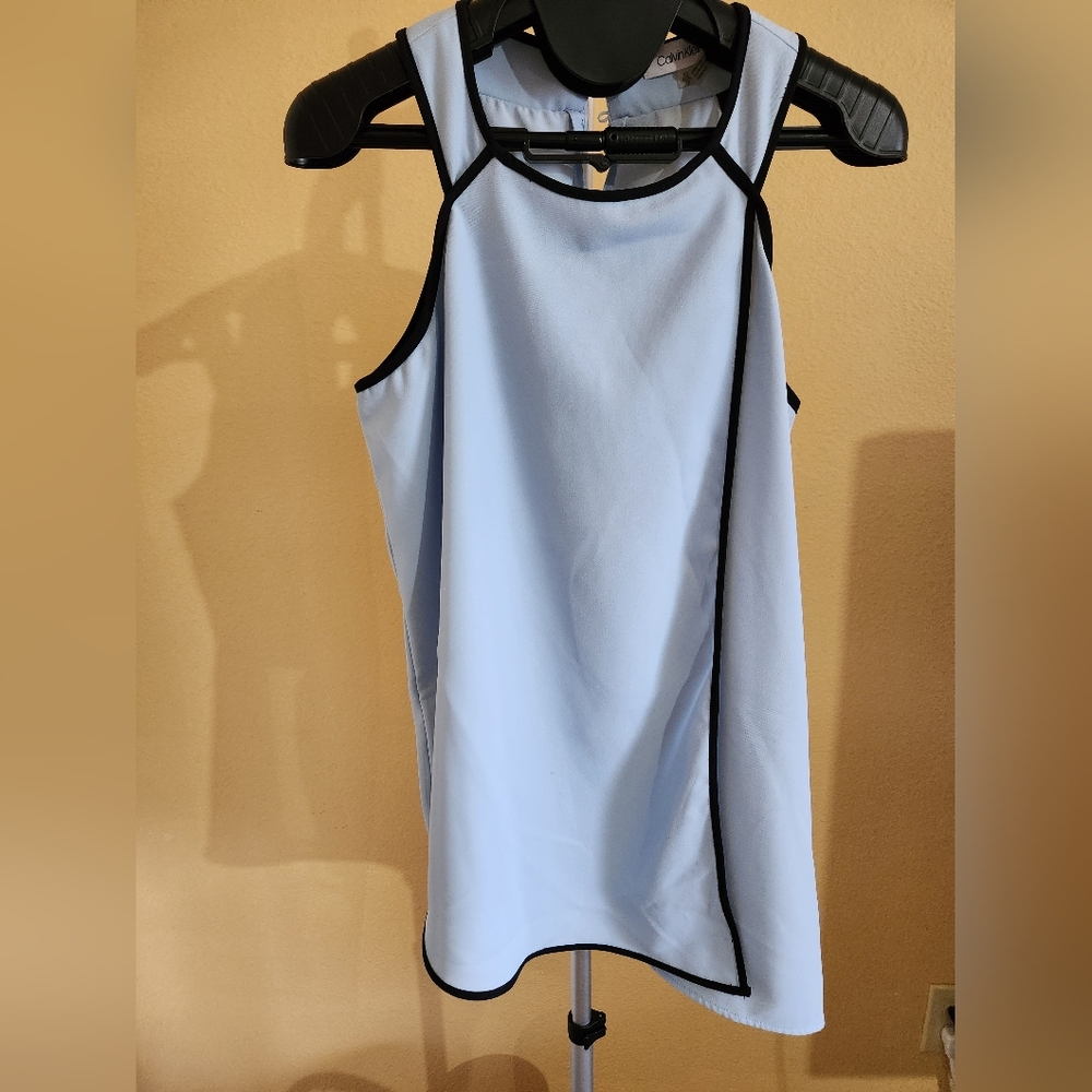 Light blue business casual tank top with black trim.